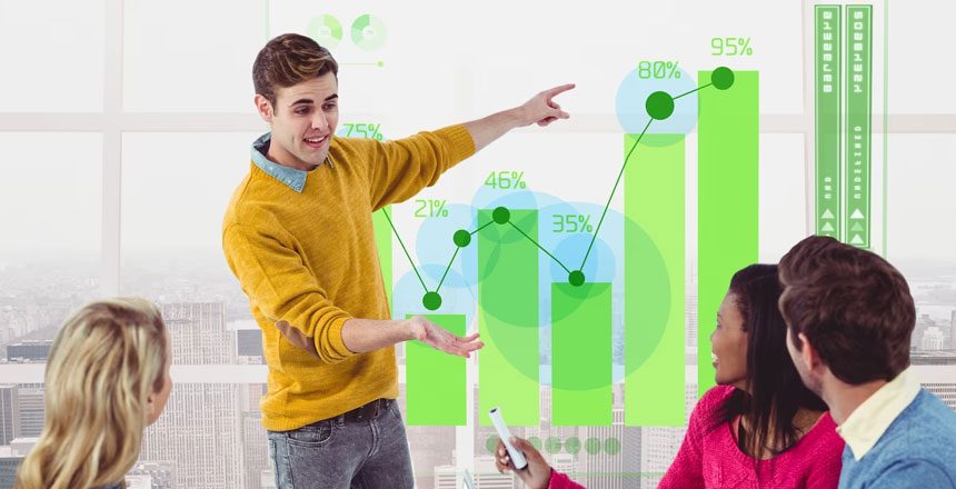 A man and woman are pointing to a graph.