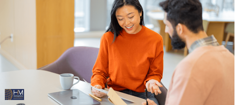 Two people discussing business in an office.