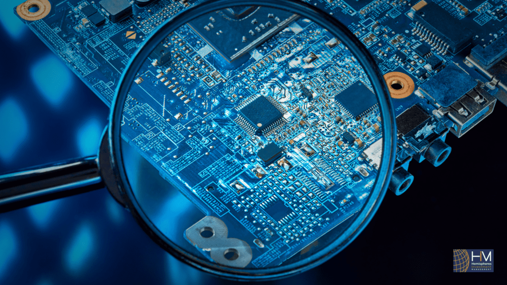 Magnifying glass on circuit board detail.